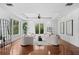 Bright sitting room with hardwood floors and access to patio at 5919 Gulf Of Mexico Dr, Longboat Key, FL 34228