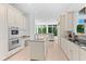 Well-lit kitchen with granite countertops, stainless steel appliances at 5919 Gulf Of Mexico Dr, Longboat Key, FL 34228