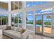 Bright living room boasting floor-to-ceiling windows with ocean views at 5919 Gulf Of Mexico Dr, Longboat Key, FL 34228