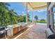 Outdoor kitchen with built-in grill and sink, perfect for entertaining with ocean breezes at 5919 Gulf Of Mexico Dr, Longboat Key, FL 34228