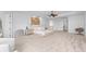 Large main bedroom with plush carpet, neutral tones, and ensuite bathroom at 5919 Gulf Of Mexico Dr, Longboat Key, FL 34228