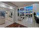 Living room with water views, high ceilings and hardwood floors at 5919 Gulf Of Mexico Dr, Longboat Key, FL 34228