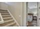 Upstairs hall with carpet stairs and a view of a bedroom at 6931 Brier Creek Ct, Lakewood Ranch, FL 34202