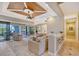 Open living room with a view of the pool and kitchen at 6931 Brier Creek Ct, Lakewood Ranch, FL 34202