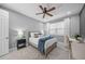 Inviting bedroom features a ceiling fan, neutral colors, and a cozy bed, creating a restful and peaceful retreat at 7139 Sandhills Pl, Lakewood Ranch, FL 34202