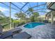 Beautiful screened pool area with a peaceful view of the green golf course at 7139 Sandhills Pl, Lakewood Ranch, FL 34202