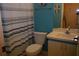 Clean bathroom with shower/tub combo and striped curtain at 7201 29Th Avenue W Dr # 306, Bradenton, FL 34209