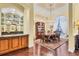 Formal dining room with hardwood floors and chandelier at 7969 Royal Birkdale Cir, Lakewood Ranch, FL 34202