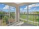 Spacious balcony with scenic views of lush landscaping and water at 9630 Club South Cir # 6303, Sarasota, FL 34238