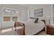 Bright bedroom with large windows and hardwood floors at 10530 Boardwalk Loop # 601, Bradenton, FL 34202