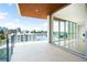 Expansive balcony offers stunning city and harbor views, seamlessly integrated with a contemporary interior at 111 Golden Gate Pt # 602, Sarasota, FL 34236