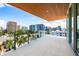Expansive balcony with panoramic city views, providing ample space for outdoor living and entertaining at 111 Golden Gate Pt # 602, Sarasota, FL 34236