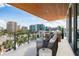 Inviting balcony with comfortable seating and scenic city views, perfect for enjoying the outdoors at 111 Golden Gate Pt # 602, Sarasota, FL 34236