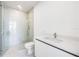 Modern bathroom featuring a glass shower, tile floors, and white vanity with sink at 111 Golden Gate Pt # 602, Sarasota, FL 34236