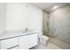 Modern bathroom featuring a glass shower, tile floors, and white vanity with sink at 111 Golden Gate Pt # 602, Sarasota, FL 34236