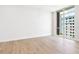 Bright bedroom with a large window offering cityscape views and lots of light at 111 Golden Gate Pt # 602, Sarasota, FL 34236