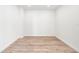 A bright bedroom featuring light wood floors and neutral wall tones at 111 Golden Gate Pt # 602, Sarasota, FL 34236