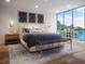 Serene bedroom featuring a plush bed, city views, and stylish decor for a relaxing retreat at 111 Golden Gate Pt # 602, Sarasota, FL 34236