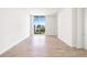 Bright, airy bedroom with large window and hardwood floors overlooks the city at 111 Golden Gate Pt # 602, Sarasota, FL 34236