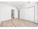 Bright bedroom features hardwood floors, ensuite bathroom and closet, providing a blend of comfort and style at 111 Golden Gate Pt # 602, Sarasota, FL 34236