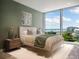 Modern bedroom with stylish furnishings, a large window, and scenic views at 111 Golden Gate Pt # 602, Sarasota, FL 34236