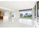 Bright living space with panoramic city views and adjacent modern kitchen at 111 Golden Gate Pt # 602, Sarasota, FL 34236