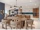 Stylish open-concept living and dining area with modern furnishings, a fireplace, and a view of the water at 111 Golden Gate Pt # 602, Sarasota, FL 34236