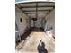 Attached garage with storage shelving and door at 1308 72Nd E St, Palmetto, FL 34221