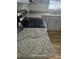A detailed look at a granite kitchen countertop and stainless steel appliances in a renovated kitchen at 1308 72Nd E St, Palmetto, FL 34221