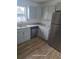 Bright kitchen with stainless steel appliances, gray cabinets, and granite countertops at 1308 72Nd E St, Palmetto, FL 34221