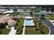 Community pool with a cabana and lounge chairs at 1420 Turnberry Dr, Venice, FL 34292