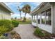 Brick paved patio with access to the sunroom and backyard at 1420 Turnberry Dr, Venice, FL 34292