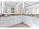 Bathroom with double vanity and large mirror at 1516 S Orange Ave, Sarasota, FL 34239