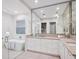 Spa-like bathroom with soaking tub, walk-in shower, and double vanity at 1516 S Orange Ave, Sarasota, FL 34239