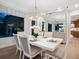 Bright dining room with white table and chandelier, mirror accent wall at 1516 S Orange Ave, Sarasota, FL 34239