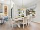 Elegant dining room with large windows and a beautiful chandelier at 1516 S Orange Ave, Sarasota, FL 34239