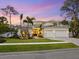 Beautiful two-story home at dusk at 1516 S Orange Ave, Sarasota, FL 34239