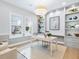 Bright home office with built-in shelving, a large desk, and plenty of natural light at 1516 S Orange Ave, Sarasota, FL 34239