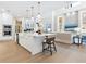 Open concept kitchen and living area with white cabinets and large island at 1516 S Orange Ave, Sarasota, FL 34239