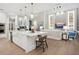 Spacious kitchen island with white cabinets and a view into the living area at 1516 S Orange Ave, Sarasota, FL 34239