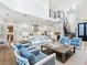 Open concept living room with kitchen, high ceilings, and hardwood floors at 1516 S Orange Ave, Sarasota, FL 34239