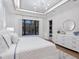 Main bedroom with white dresser, large windows, and pool view at 1516 S Orange Ave, Sarasota, FL 34239