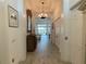 Bright and spacious foyer with elegant flooring and a view into the living room at 15618 Castle Park Ter, Lakewood Ranch, FL 34202