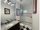 Stylish bathroom features granite countertops, elegant mirrors, framed art and a glass shower at 15618 Castle Park Ter, Lakewood Ranch, FL 34202