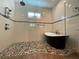 Elegant bathroom boasting a freestanding tub, glass shower, and stylish fixtures at 15618 Castle Park Ter, Lakewood Ranch, FL 34202
