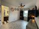 Bedroom with decor, ceiling fan and closet with a bathroom in the background at 15618 Castle Park Ter, Lakewood Ranch, FL 34202