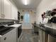 Organized laundry room with white cabinetry, modern washer/dryer, and ample counter space at 15618 Castle Park Ter, Lakewood Ranch, FL 34202