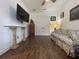Cozy living room with a floral sofa, television, and unique column accents at 15618 Castle Park Ter, Lakewood Ranch, FL 34202