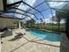 Sparkling pool and spa with screen enclosure and golf course views for outdoor enjoyment at 15618 Castle Park Ter, Lakewood Ranch, FL 34202