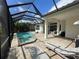 Enjoy a screened-in pool with a jacuzzi, outdoor kitchen and brick patio for ultimate relaxation and entertaining at 15618 Castle Park Ter, Lakewood Ranch, FL 34202